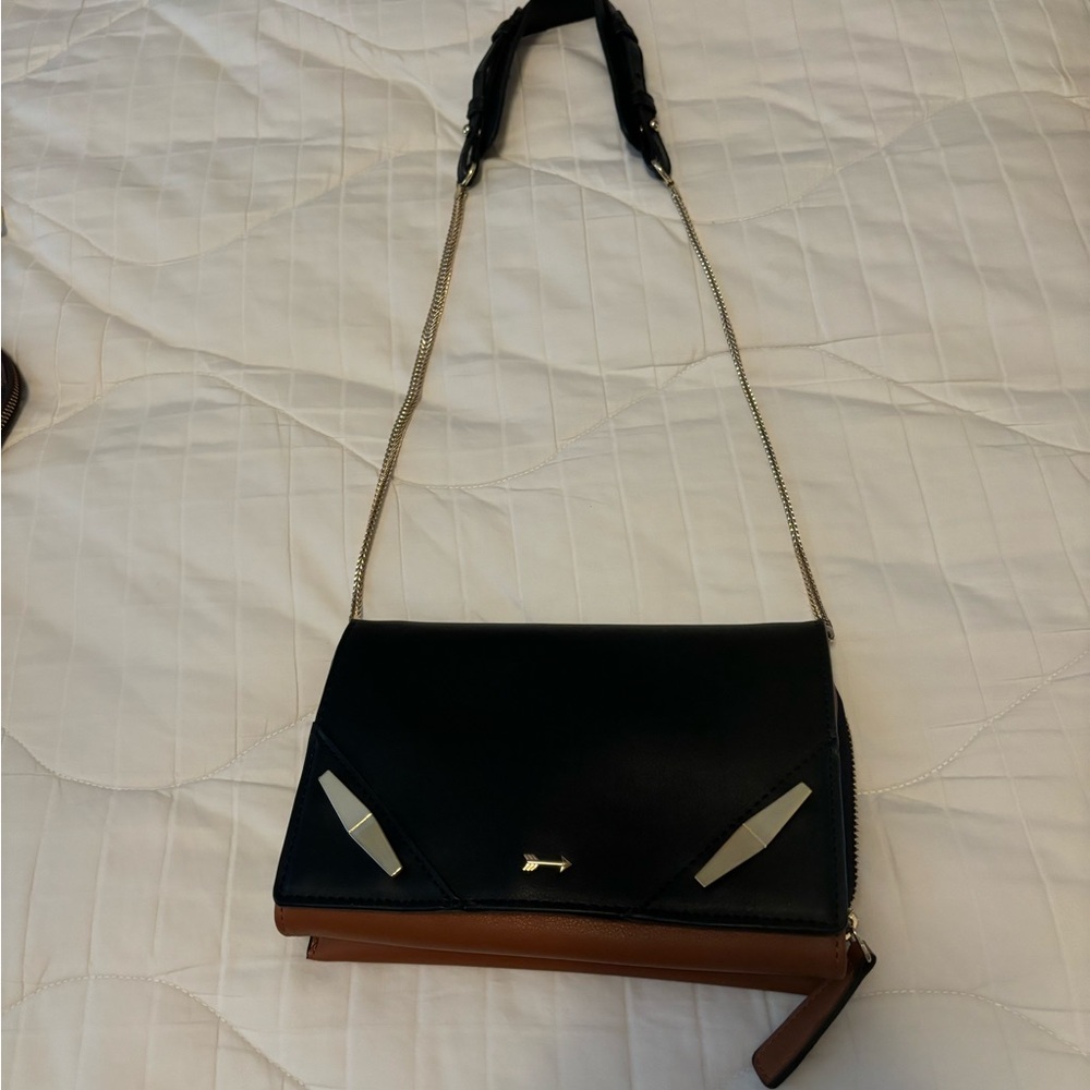 Black and brown Gianni Bono purse with gold and black strap